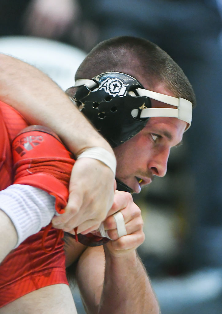Missouri's Dylan Wisman holds Brit Wilson's foot during a match